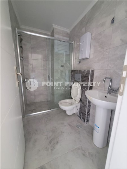 Two bedroom apartment, 90m² in a complex with a swimming pool under construction, in Alanya - Oba-id-1566-photo-9