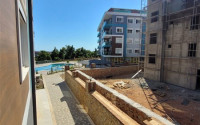 Two bedroom apartment, 90m² in a complex with a swimming pool under construction, in Alanya - Oba-id-1566-photo-11