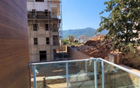 Two bedroom apartment, 90m² in a complex with a swimming pool under construction, in Alanya - Oba-id-1566-photo-12
