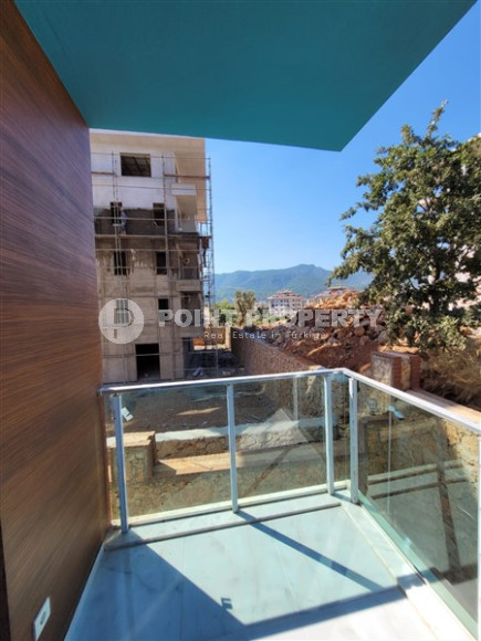 Two bedroom apartment, 90m² in a complex with a swimming pool under construction, in Alanya - Oba-id-1566-photo-12