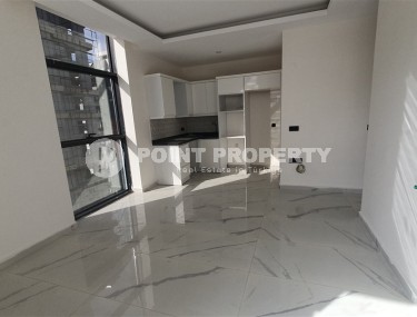 Небольшая квартира 1+1 с чистой отделкой в 700 метрах от моря, в современном центре района Аланьи - Махмутлар-id-7337-фото-2