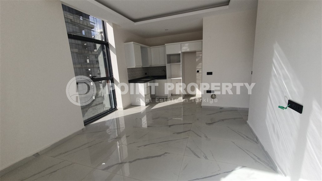 Небольшая квартира 1+1 с чистой отделкой в 700 метрах от моря, в современном центре района Аланьи - Махмутлар-id-7337-фото-2