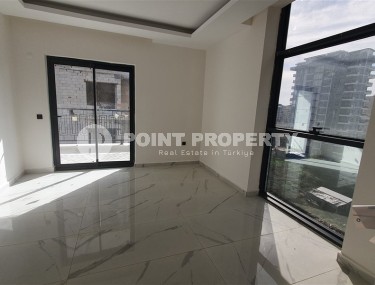 Небольшая квартира 1+1 с чистой отделкой в 700 метрах от моря, в современном центре района Аланьи - Махмутлар-id-7337-фото-3