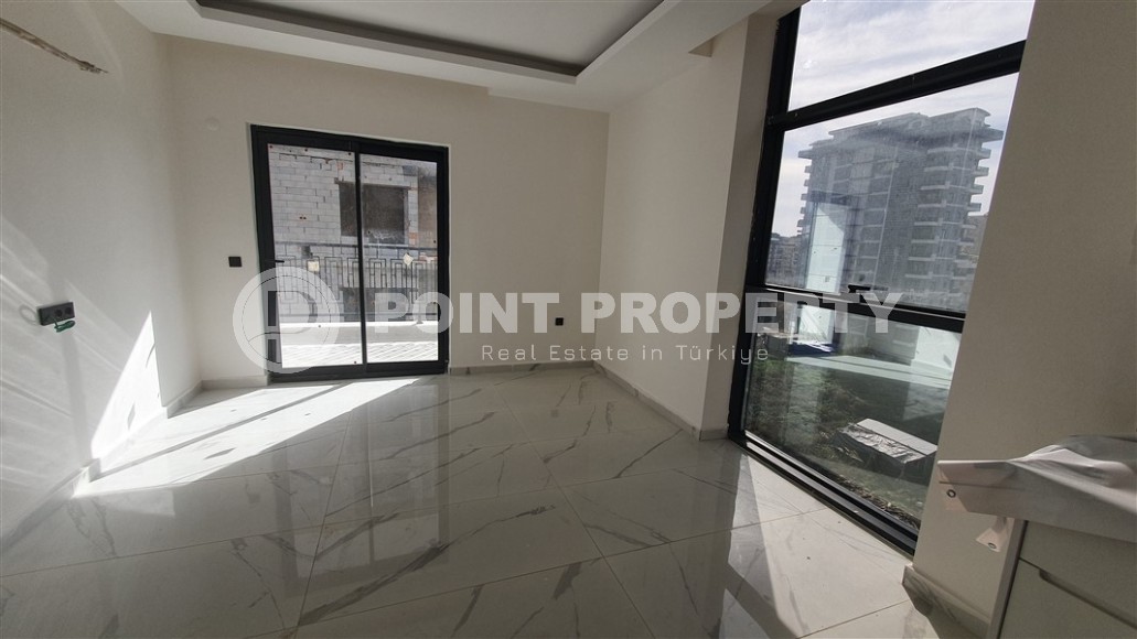 Небольшая квартира 1+1 с чистой отделкой в 700 метрах от моря, в современном центре района Аланьи - Махмутлар-id-7337-фото-3