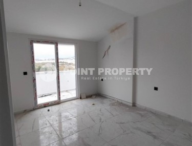 Небольшая квартира 1+1 с чистой отделкой в 700 метрах от моря, в современном центре района Аланьи - Махмутлар-id-7337-фото-4