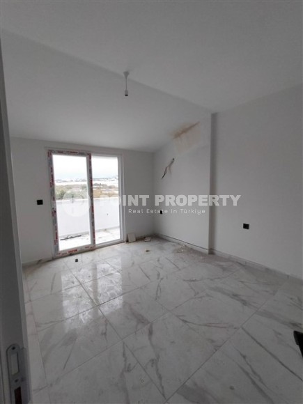 Небольшая квартира 1+1 с чистой отделкой в 700 метрах от моря, в современном центре района Аланьи - Махмутлар-id-7337-фото-4