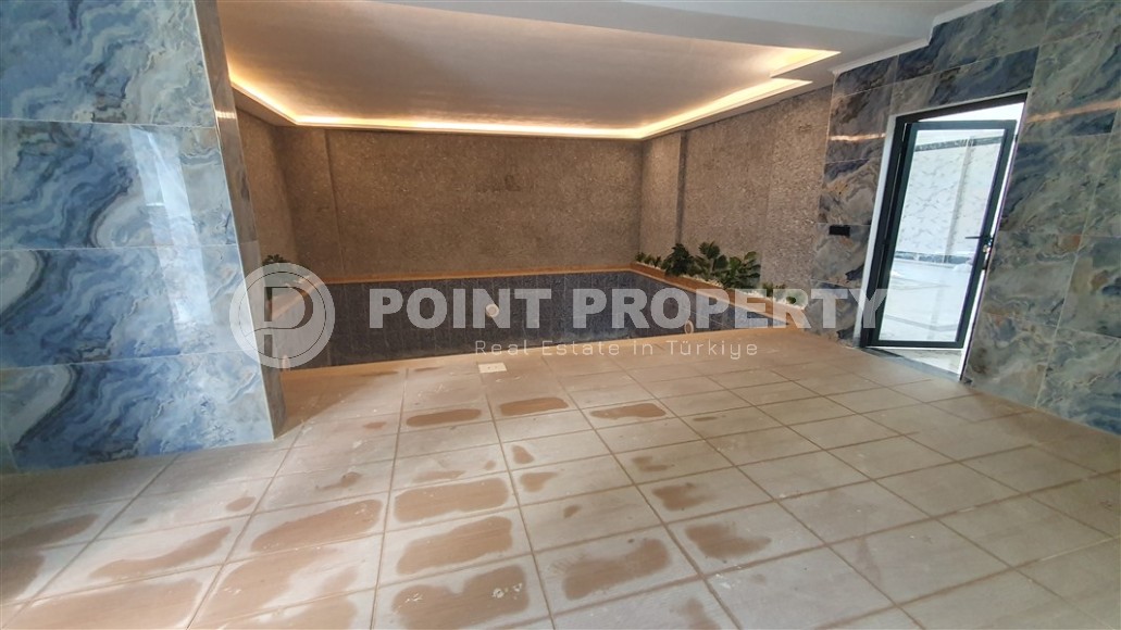 Небольшая квартира 1+1 с чистой отделкой в 700 метрах от моря, в современном центре района Аланьи - Махмутлар-id-7337-фото-11