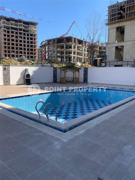 Небольшая квартира 1+1 с чистой отделкой в 700 метрах от моря, в современном центре района Аланьи - Махмутлар-id-7337-фото-13