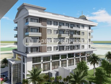 Новые апартаменты 1+1 в здании на этапе строительства в 200 метрах от моря в центре района Каргыджак.-id-4123-фото-2