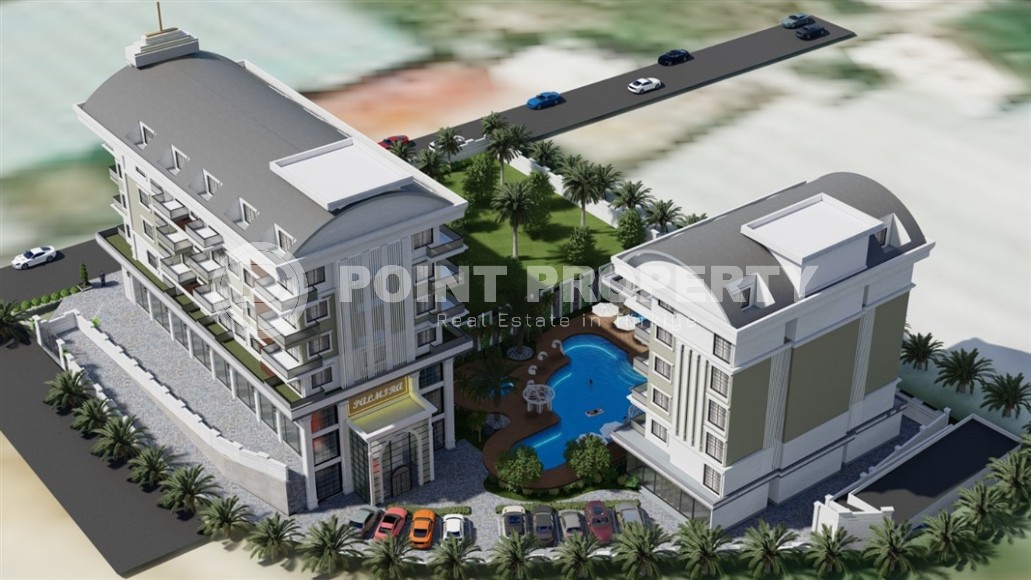 Новые апартаменты 1+1 в здании на этапе строительства в 200 метрах от моря в центре района Каргыджак.-id-4123-фото-3