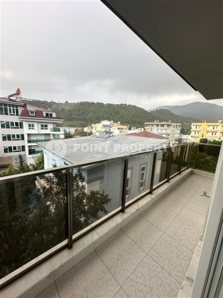 Современная двухуровневая квартира 2+1 с видом на горы, в зеленом, экологически чистом районе Аланьи - Кестель-id-7348-фото-16