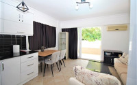One bedroom apartment, 55m², in a complex with a swimming pool 100m from the sea in Oba, Alanya.-id-1571-photo-3