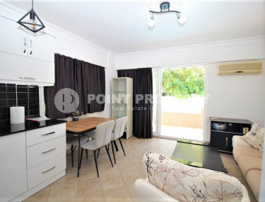 One bedroom apartment, 55m², in a complex with a swimming pool 100m from the sea in Oba, Alanya.-id-1571-photo-3