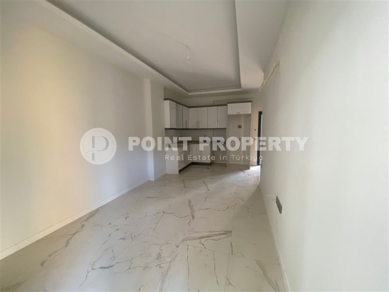 Небольшая новая квартира с чистовой отделкой в 350 метрах от моря, в центре спокойного района Аланьи - Тосмур-id-7383-фото-2