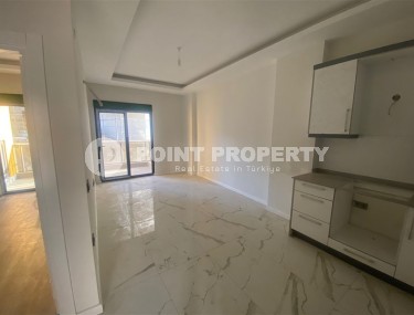 Небольшая новая квартира с чистовой отделкой в 350 метрах от моря, в центре спокойного района Аланьи - Тосмур-id-7383-фото-3