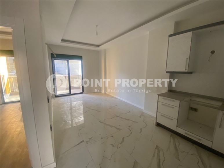 Небольшая новая квартира с чистовой отделкой в 350 метрах от моря, в центре спокойного района Аланьи - Тосмур-id-7383-фото-3