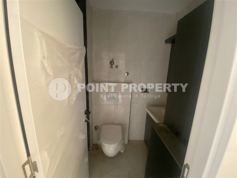 Небольшая новая квартира с чистовой отделкой в 350 метрах от моря, в центре спокойного района Аланьи - Тосмур-id-7383-фото-6