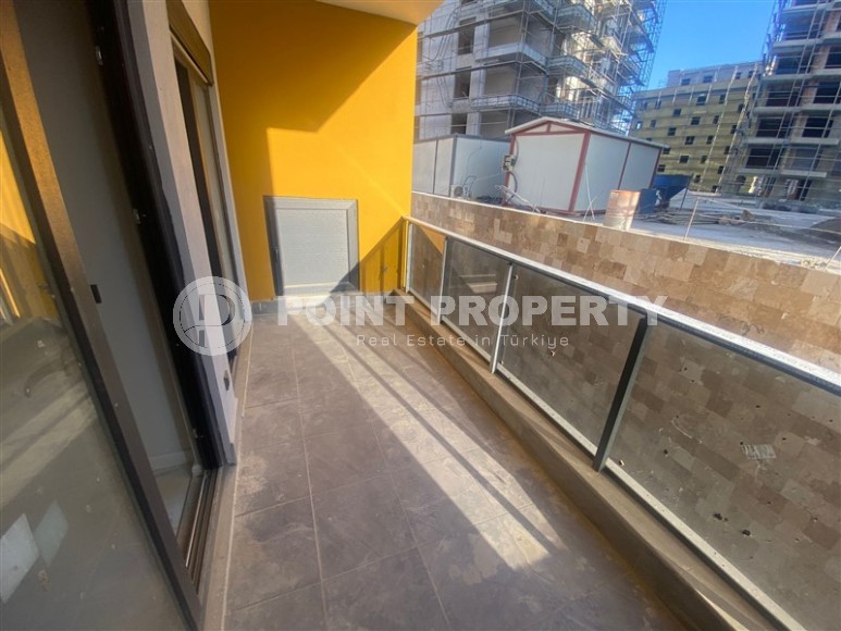 Небольшая новая квартира с чистовой отделкой в 350 метрах от моря, в центре спокойного района Аланьи - Тосмур-id-7383-фото-7