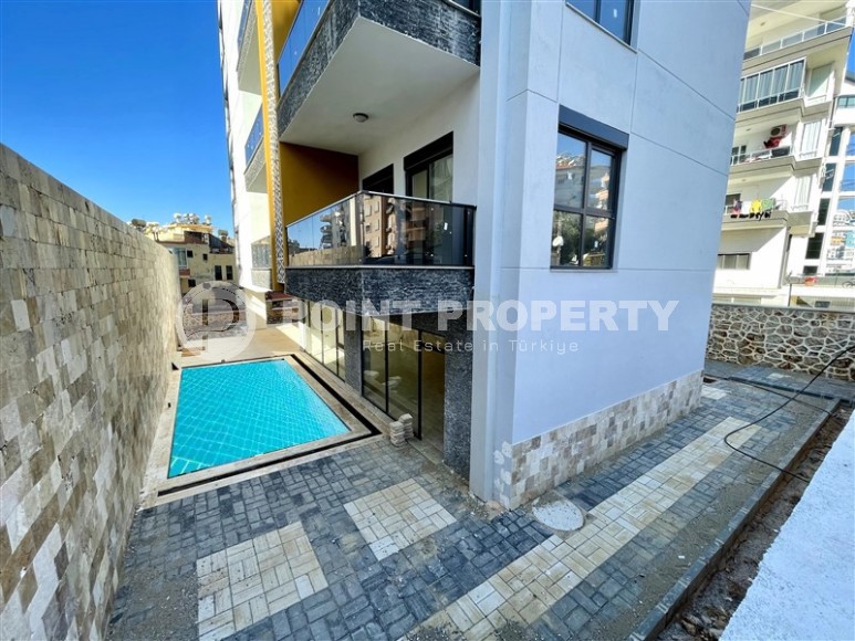 Небольшая новая квартира с чистовой отделкой в 350 метрах от моря, в центре спокойного района Аланьи - Тосмур-id-7383-фото-11