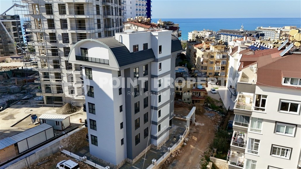 Небольшая новая квартира с чистовой отделкой в 350 метрах от моря, в центре спокойного района Аланьи - Тосмур-id-7383-фото-12