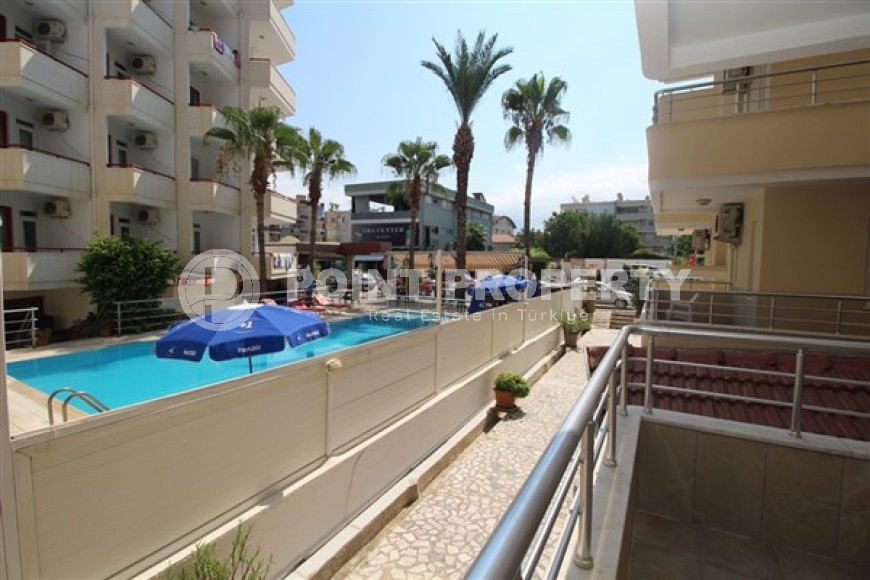 One bedroom apartment, 55m², in a complex with a swimming pool 100m from the sea in Oba, Alanya.-id-1571-photo-18