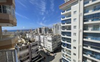 Furnished apartment 2+1 with panoramic views of the city and the sea, 600 meters from the sea, in the center of Mahmutlar-id-7418-photo-22