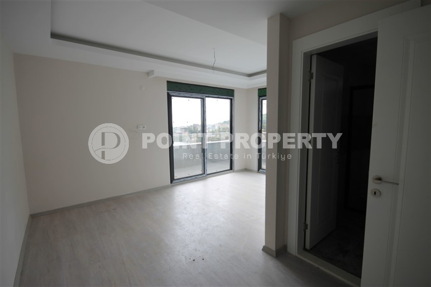 New apartment with fine finishing four kilometers from the sea, in a green, environmentally friendly area of Alanya - Ciplakli-id-7430-photo-11