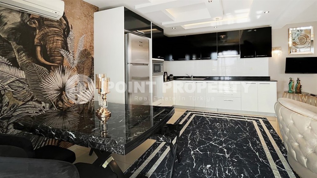 Stylish two-level apartment with designer renovation 800 meters from the sea, in a quiet area of Alanya - Cikcilli-id-7478-photo-4