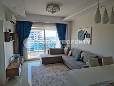 Просторная квартира 1+1, общей площадью 70 м2, на 8-м этаже в центре современного района Аланьи - Махмутлар-id-7502-фото-1