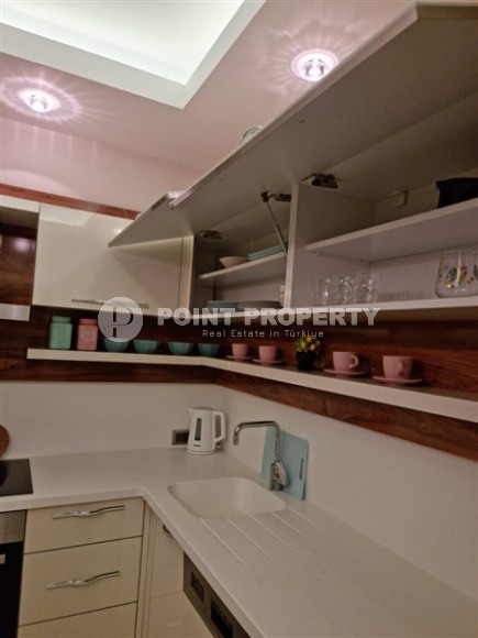 Просторная квартира 1+1, общей площадью 70 м2, на 8-м этаже в центре современного района Аланьи - Махмутлар-id-7502-фото-4