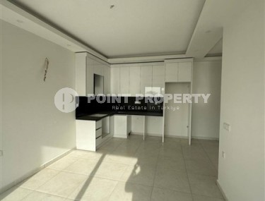 Panoramic apartment 1+1 with city views, on the 8th floor in the center of Mahmutlar-id-7506-photo-2