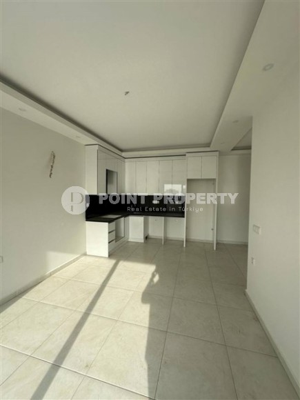 Панорамная квартира 1+1 с видом на город, на 8-м этаже в центре района Махмутлар-id-7506-фото-2