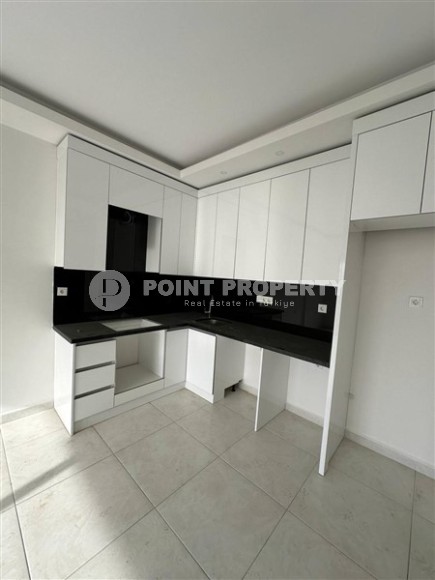 Панорамная квартира 1+1 с видом на город, на 8-м этаже в центре района Махмутлар-id-7506-фото-3