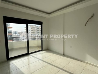 Panoramic apartment 1+1 with city views, on the 8th floor in the center of Mahmutlar-id-7506-photo-4