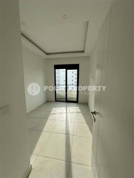 Панорамная квартира 1+1 с видом на город, на 8-м этаже в центре района Махмутлар-id-7506-фото-5