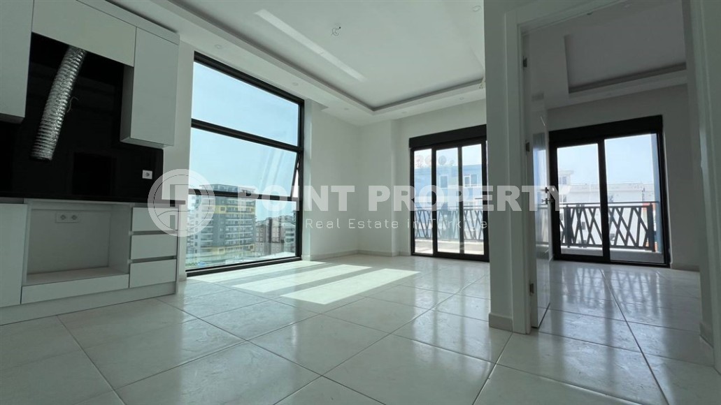 Небольшая новая квартира с чистовой отделкой, в 650 метрах от моря, в центре современного района Аланьи - Махмутлар-id-7507-фото-2