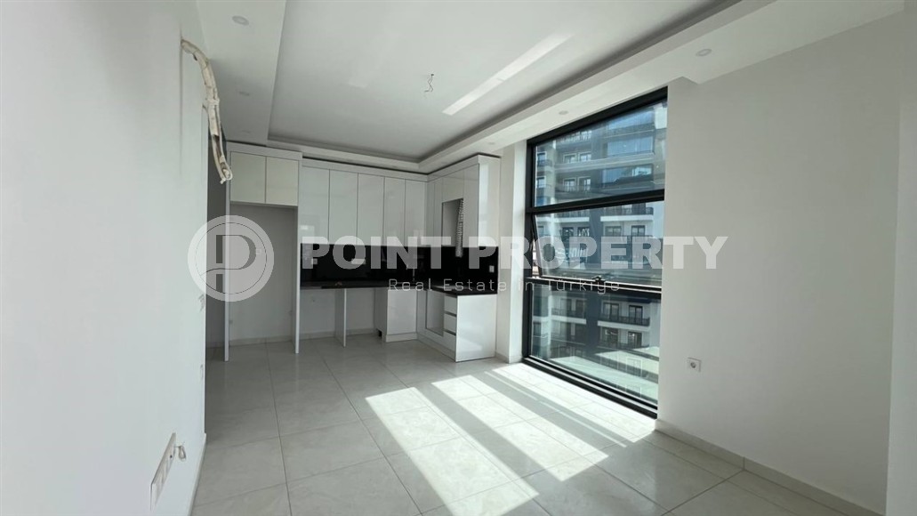 Небольшая новая квартира с чистовой отделкой, в 650 метрах от моря, в центре современного района Аланьи - Махмутлар-id-7507-фото-3