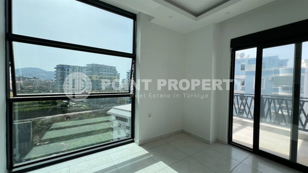 Небольшая новая квартира с чистовой отделкой, в 650 метрах от моря, в центре современного района Аланьи - Махмутлар-id-7507-фото-4