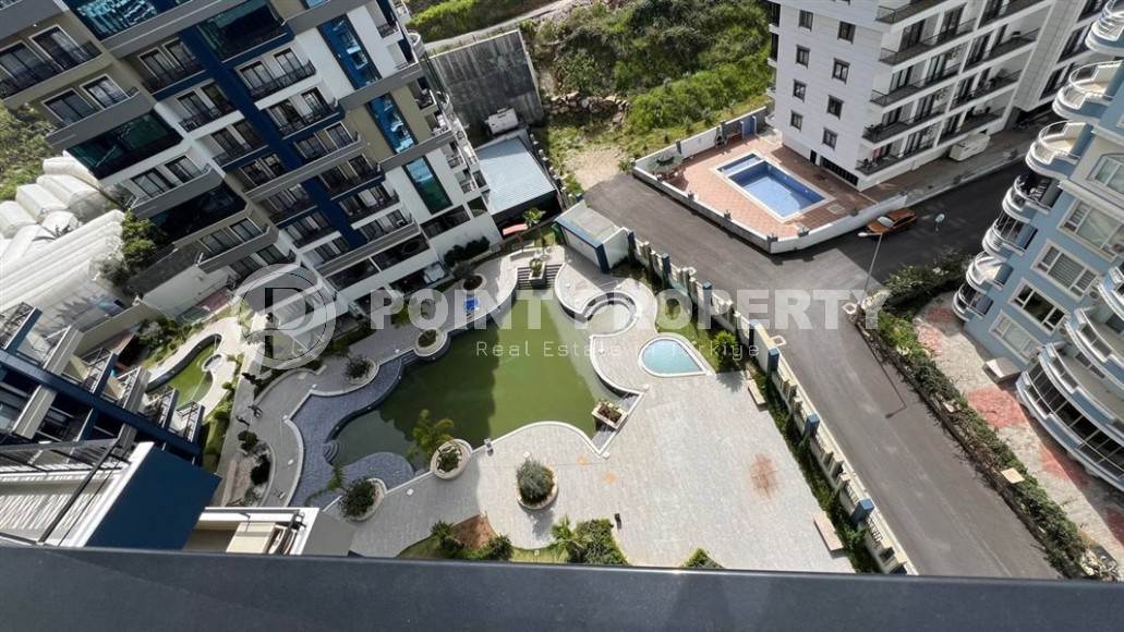 Небольшая новая квартира с чистовой отделкой, в 650 метрах от моря, в центре современного района Аланьи - Махмутлар-id-7507-фото-10