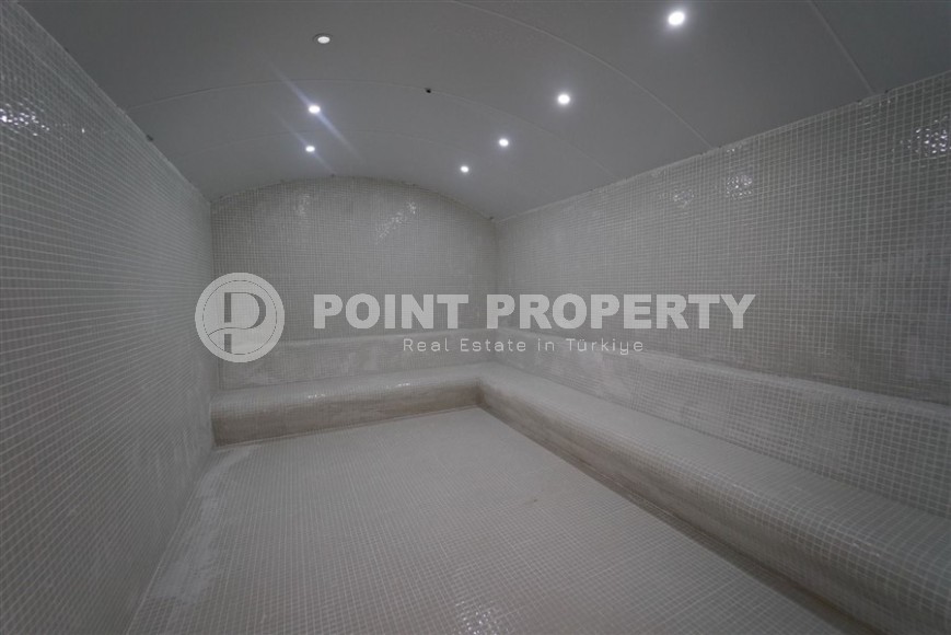 Небольшая новая квартира с чистовой отделкой, в 650 метрах от моря, в центре современного района Аланьи - Махмутлар-id-7507-фото-14