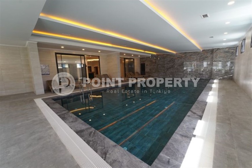 Небольшая новая квартира с чистовой отделкой, в 650 метрах от моря, в центре современного района Аланьи - Махмутлар-id-7507-фото-16