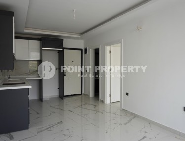 Compact new apartment with fine finishing, within walking distance from the center of the popular area of Alanya - Mahmutlar-id-7513-photo-2