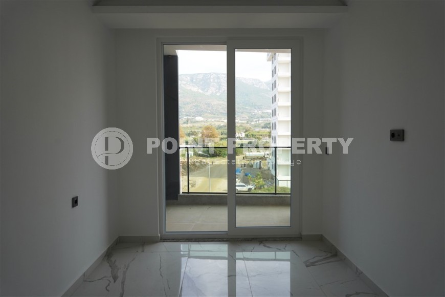 Компактная новая квартира с чистовой отделкой, в нескольких минутах ходьбы от центра популярного района Аланьи -  Махмутлар-id-7513-фото-4