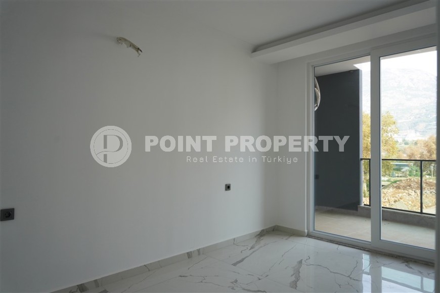 Компактная новая квартира с чистовой отделкой, в нескольких минутах ходьбы от центра популярного района Аланьи -  Махмутлар-id-7513-фото-5