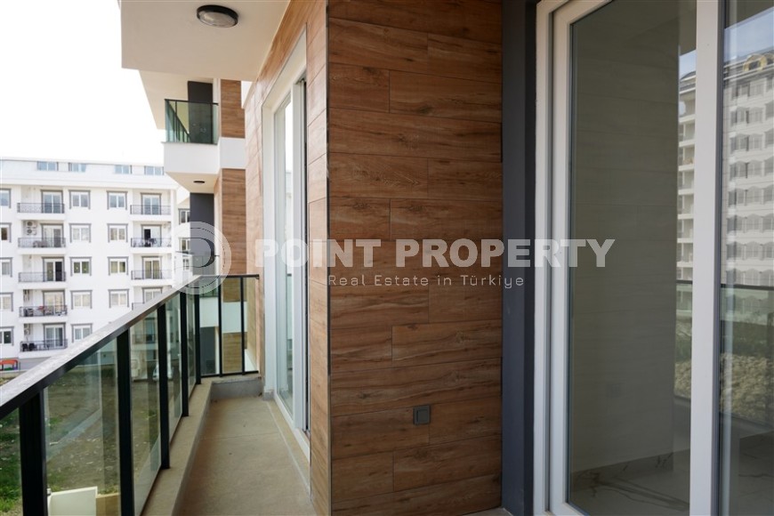 Компактная новая квартира с чистовой отделкой, в нескольких минутах ходьбы от центра популярного района Аланьи -  Махмутлар-id-7513-фото-7