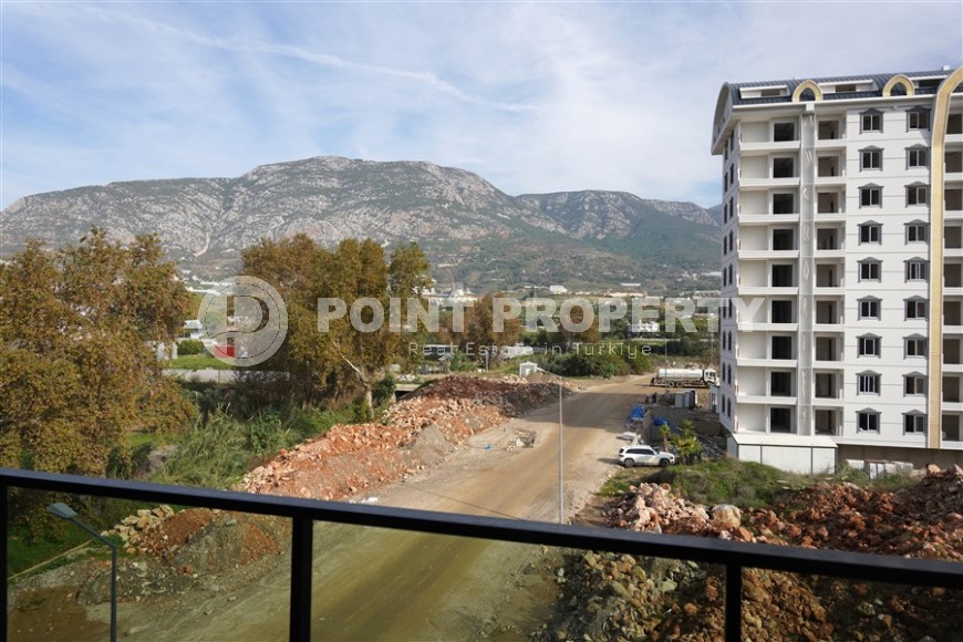 Компактная новая квартира с чистовой отделкой, в нескольких минутах ходьбы от центра популярного района Аланьи -  Махмутлар-id-7513-фото-8