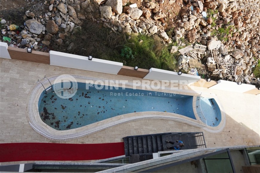 Компактная новая квартира с чистовой отделкой, в нескольких минутах ходьбы от центра популярного района Аланьи -  Махмутлар-id-7513-фото-10