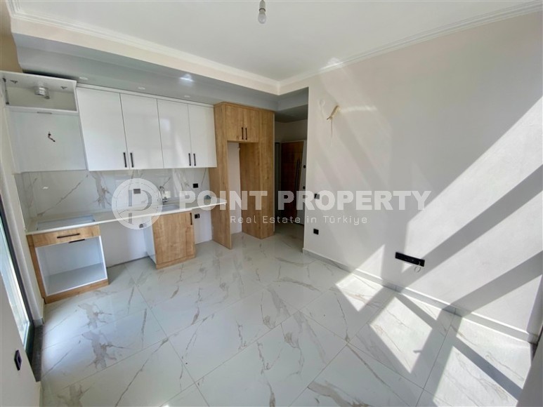 Небольшая новая квартира с качественной чистовой отделкой в полутора километрах от моря, в живописном районе Аланьи - Авсаллар-id-7520-фото-2