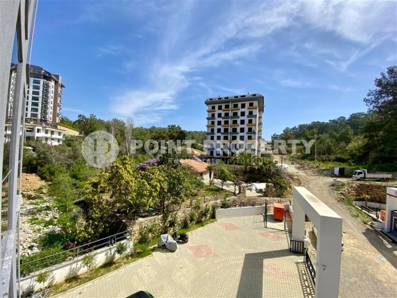 Небольшая новая квартира с качественной чистовой отделкой в полутора километрах от моря, в живописном районе Аланьи - Авсаллар-id-7520-фото-11