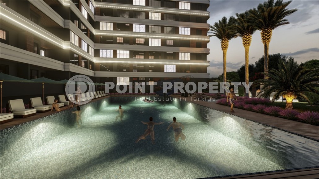 Студии и линейные квартиры в строящемся жилом комплексе, в центре перспективного района Мерсина - Томюк-id-7529-фото-9